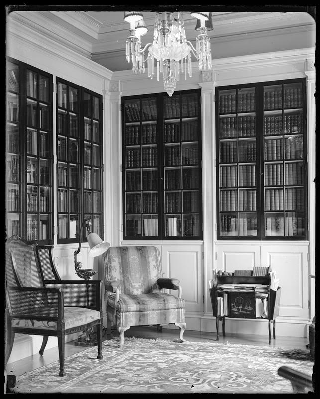 An unidentified room lined with bookshelves