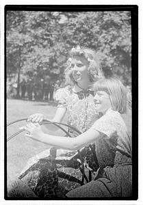 Two girls holding hoops