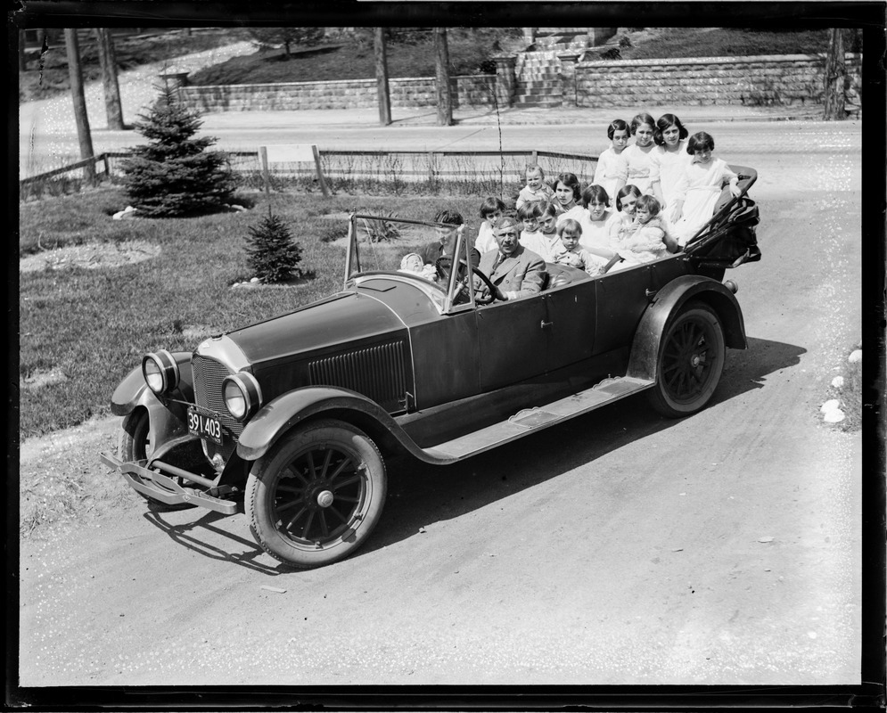 Family of thirteen in convertible
