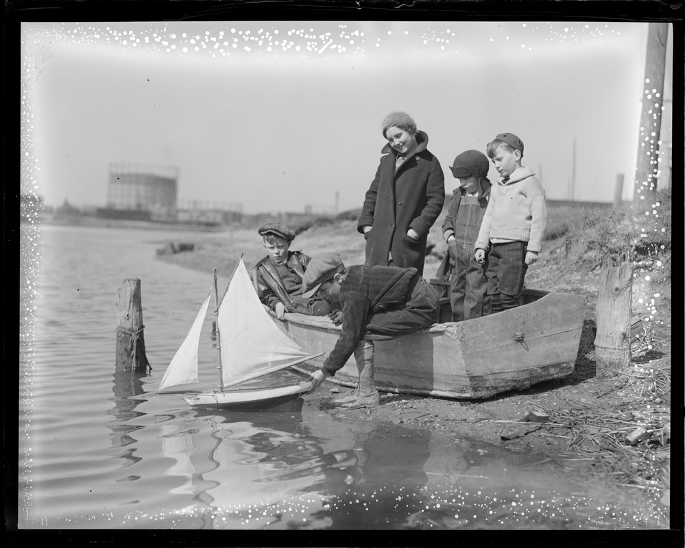 Kids launch miniature boat, signs of spring