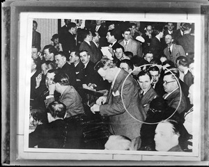 Unlabeled: Crowd of men - one man circled