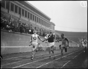 At the finish line during college track meet at Harvard Stadium