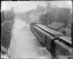 Steam train plows its way through the water after a severe rainfall