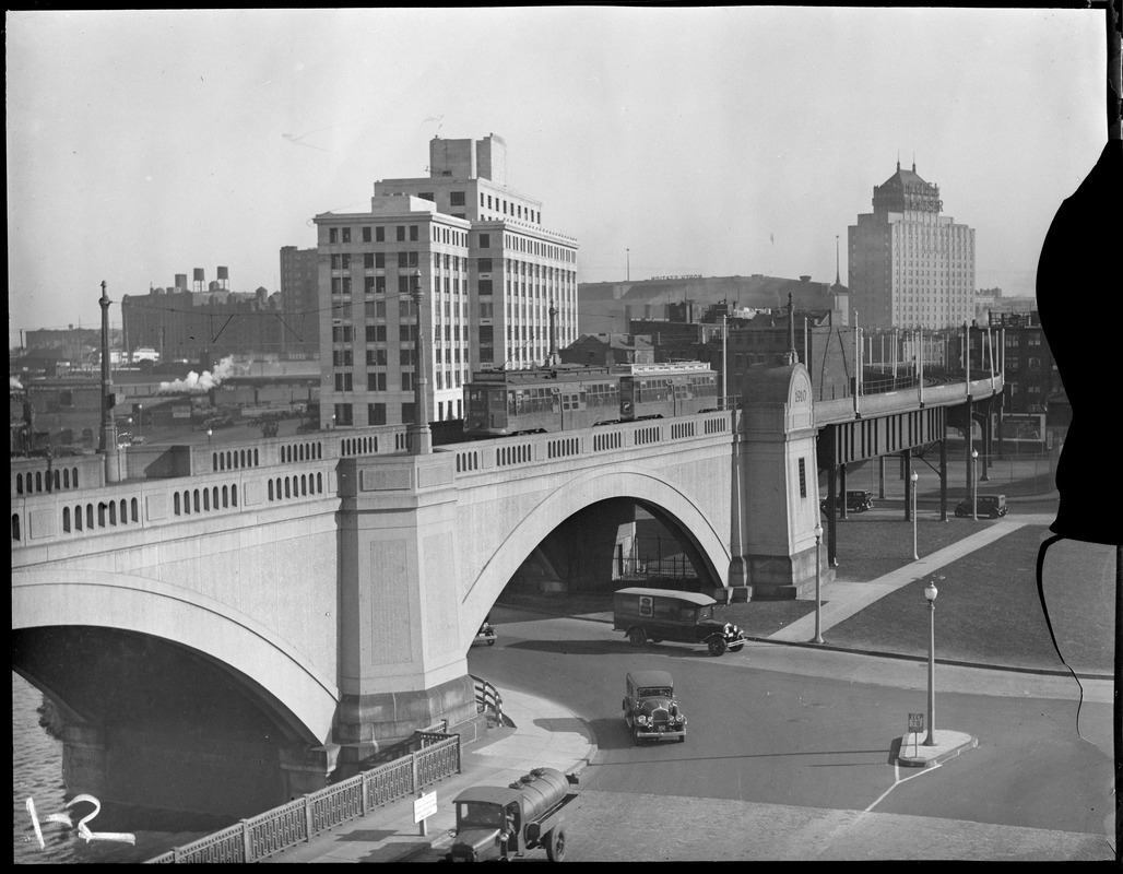 Elevated train on viaduct from draw 1 looking toward new motor vehicle building and hotel manager