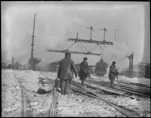 Crew de-icing tracks at South Station during blizzard