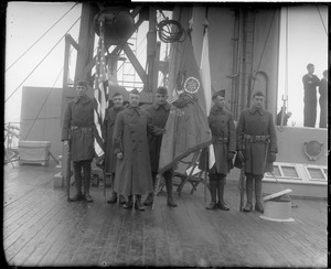 Yankee Division color guard on deck of troopship as it arrives in Boston