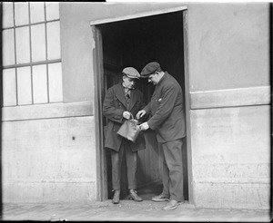 Ammunition factory men have to open their bags before leaving the factory, S.A. Woods Co., South Boston