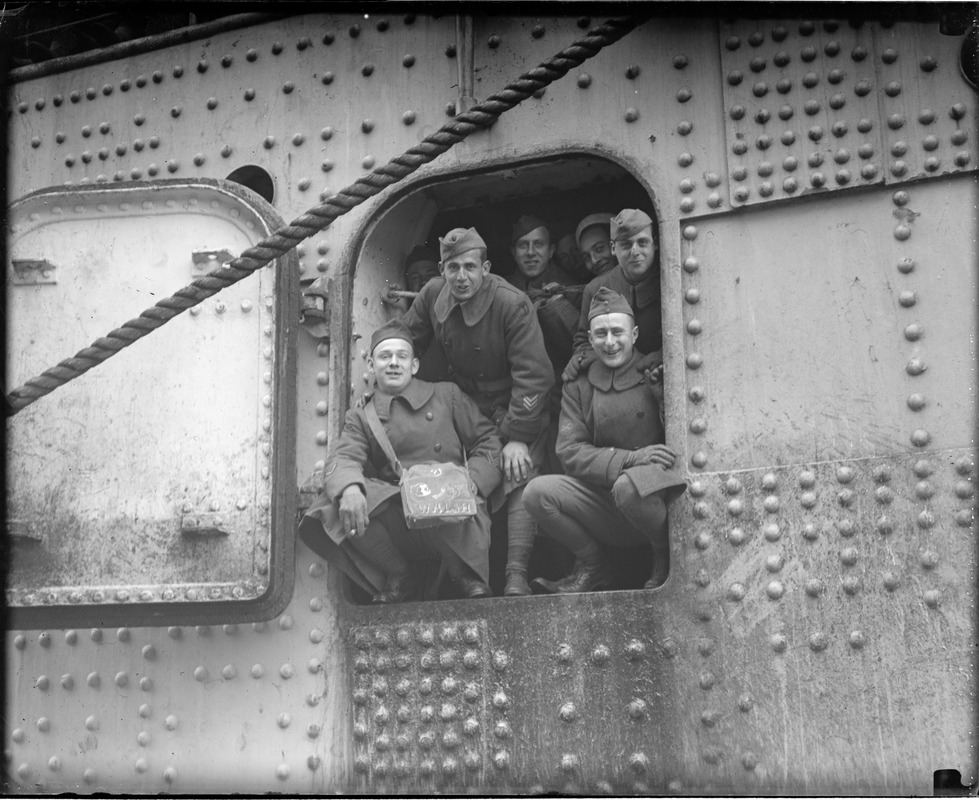 These brave boys found a small hatch in giant troopship so they could sneak out and greet their loved one