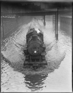 Train plowing through water