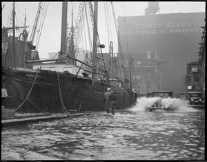 T-wharf flooded from storm, M.M. Hamilton docked, 2 masted wooden ship