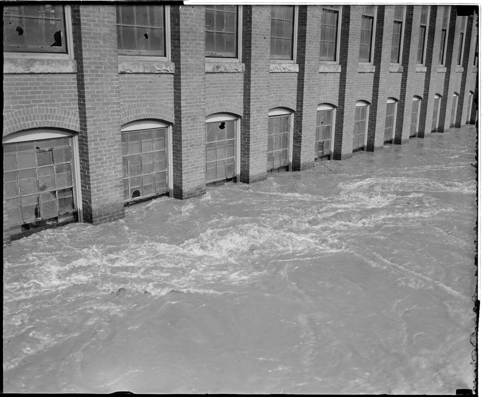 Flood waters reach windows of factory building