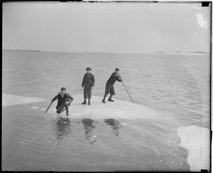 Kids ride ice cakes in Dorchester Bay
