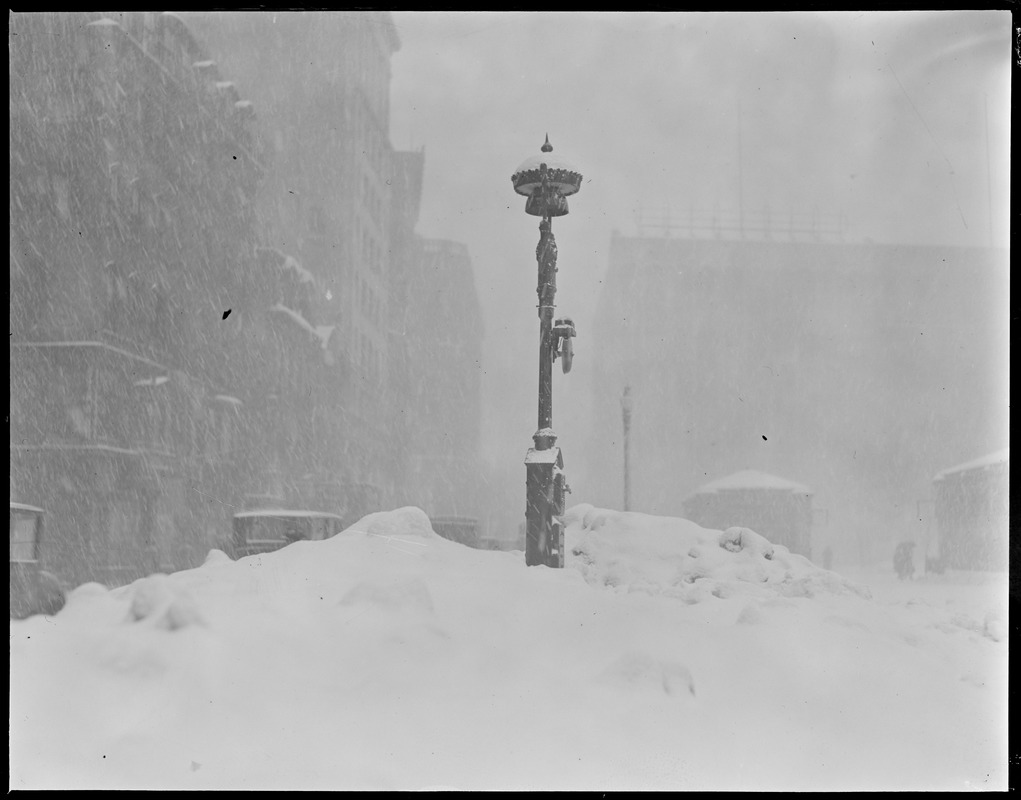 Fire alarm box almost covered up by severe snowstorm