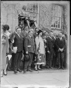 Dignitaries standing in front of John Harvard statue, Cambridge