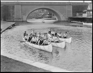 LaSalle college girls in their war canoes, Charles River, Auburndale