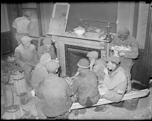 Workers on a lunch break from tearing down Old Quincy House