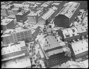 Shadow of the Custom House Tower cast on the snowy rooftops of the Market District & Commercial St.