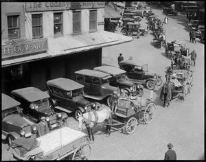 Cars and wagons clutter crowded Quincy Market
