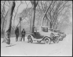 Public Garden snow-covered autos parked outside fence