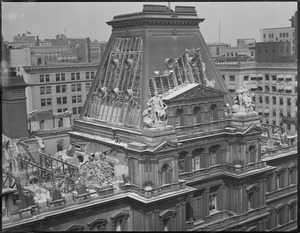 Tearing down old post office from the top