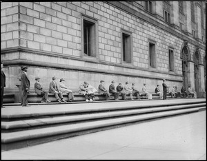 People sitting on Boston Public Library platform