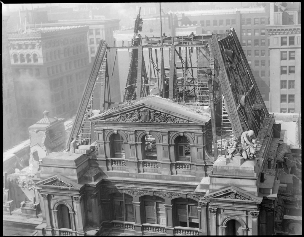Famous old post office building being torn down, showing the last of French's statue being removed, Boston, Mass.