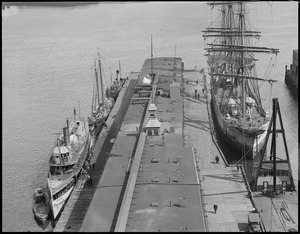 Old T-wharf (incl. large 3-masted square rigged ship on right - the Nereus, King Phillip on left, schooner[?], [illegible])