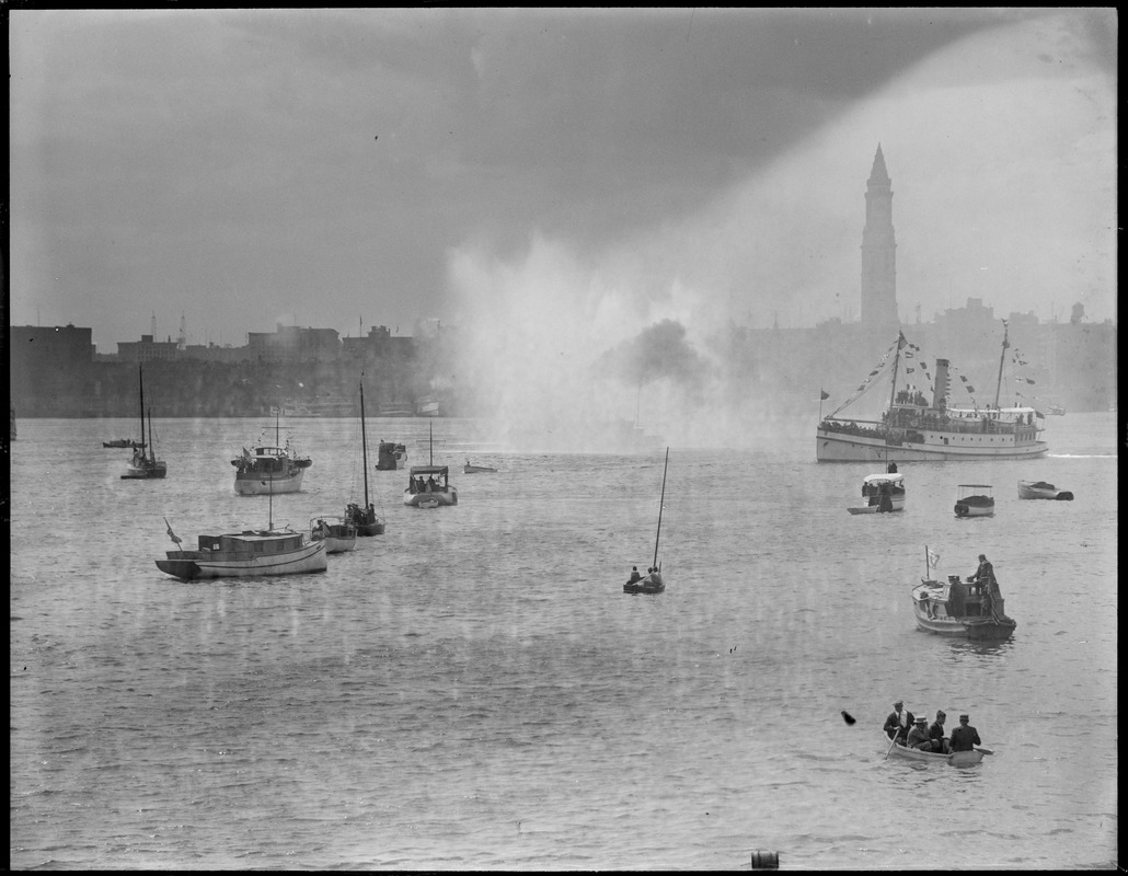 Boats in Boston Harbor; fireboat spray, steamship