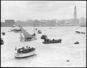 Small boats in harbor, skyline