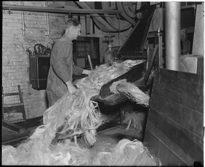 Charlestown Navy Yard/rope making. Allen Smith feeding the breaker machine.