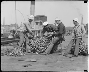 Splicing a bow fender at the Navy Yard is the crew of the navy tug Nottoway. L-R: Stanley Nida, Loren Boboar, F.E. Borue and Emmett Cobb