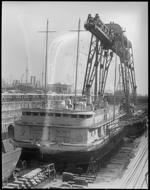 Torpedo testing barge in Navy Yard drydock with crane Hercules