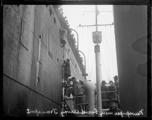 Newspapermen boarding a liner