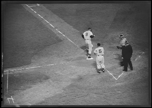 Ted Williams crosses the plate against the Indians