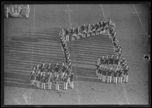 Harvard band forming music notes on field, Harvard vs. Brown