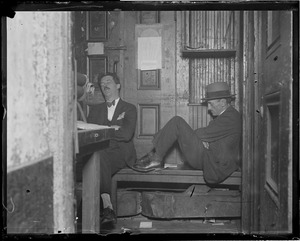 Newspaper cameramen resting in hypo row, Frank Dent, left, and Alex Machum