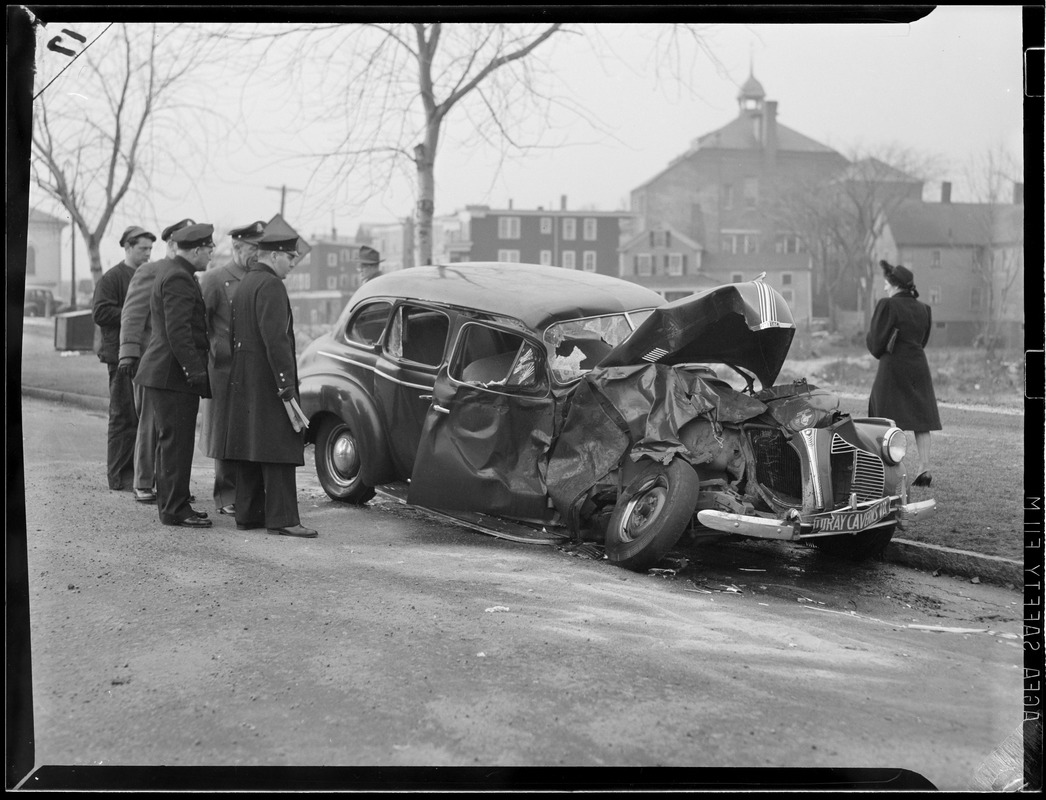 Men around an auto accident