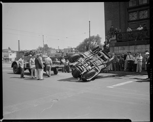 Crowd watches fire engine right car