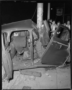 Taxi wrapped around pole