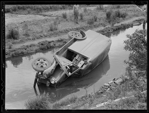 Truck goes into watery ditch