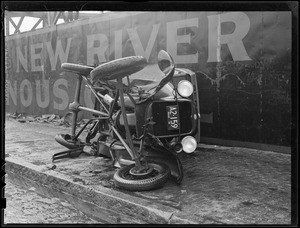 Overturned auto on sidewalk