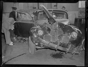 Inspecting smashed up auto