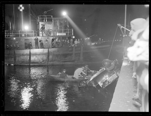 Pulling auto out of water with help of the fireboat Matthew J. Boyle