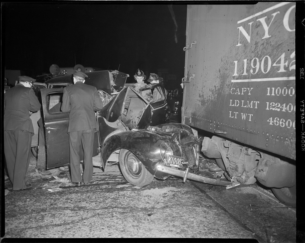 Auto hits freight car