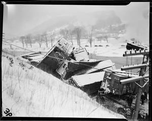 Possibly Boston & Maine RR along Deerfield River, Mass. One derailed car is a B&M outside braced box car, no. 72721