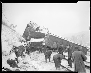 Possibly Boston & Maine RR along Deerfield River, Mass. One derailed car is a B&M outside braced box car, no. 72721