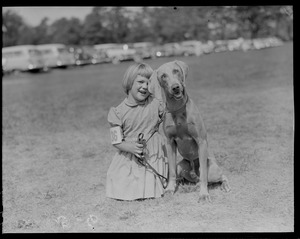 Girl with dog at dog show