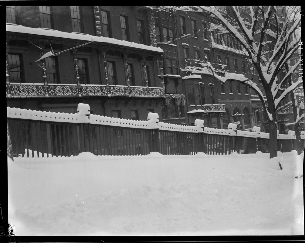 Fences in wintertime in front of State House and Boston Common