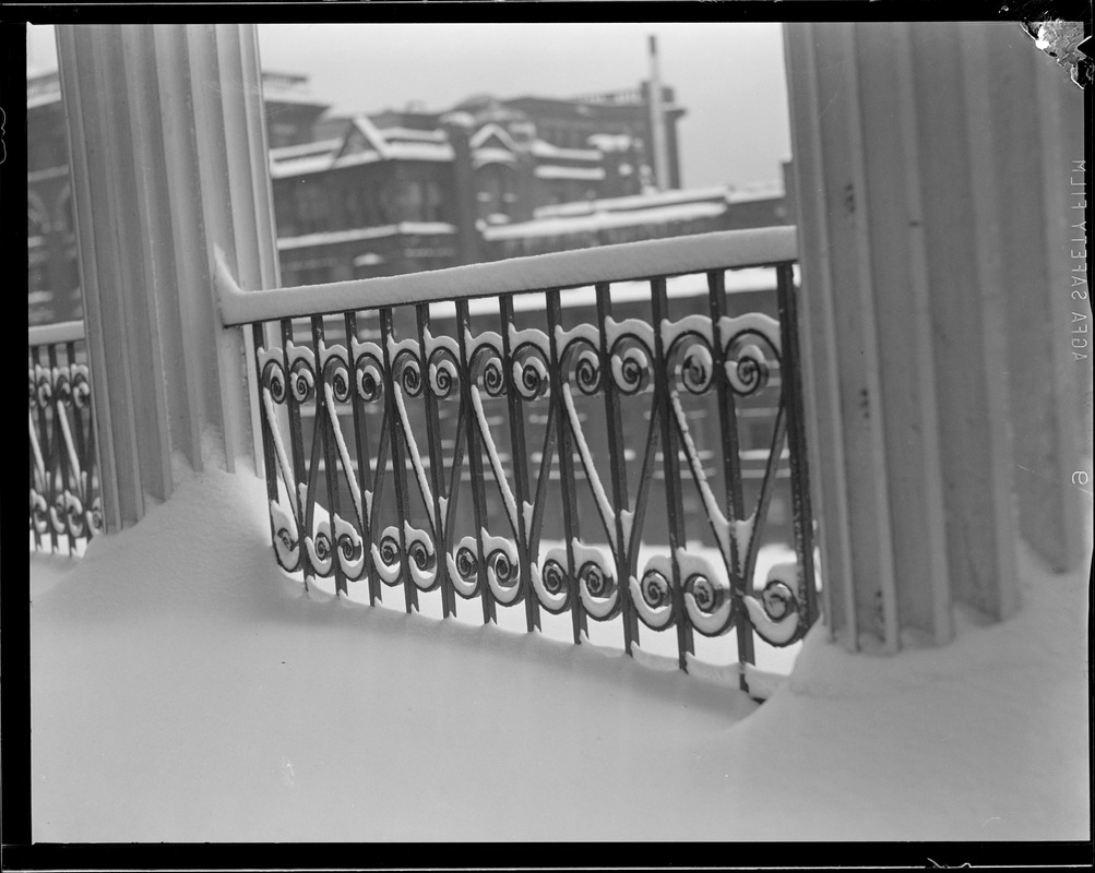 Fences in wintertime in front of State House and Boston Common