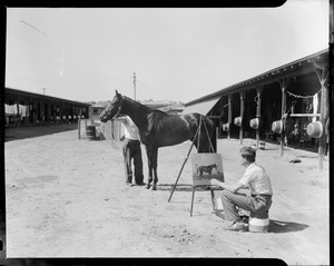 Man painting a horse